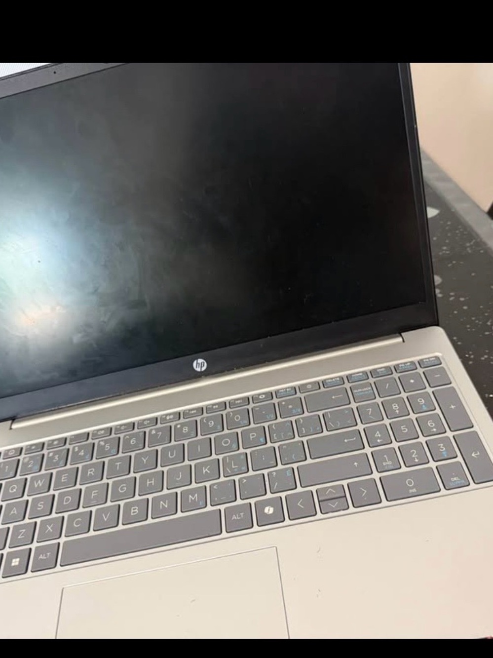 HP Silver Laptop with Gray Keyboard and Black Display Bezel